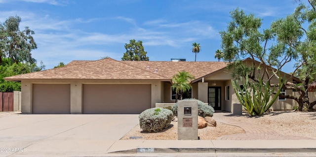 4532 E Sandra Ter, Phoenix, AZ 85032 - view of front of home with stucco siding, driveway, and an attached garage