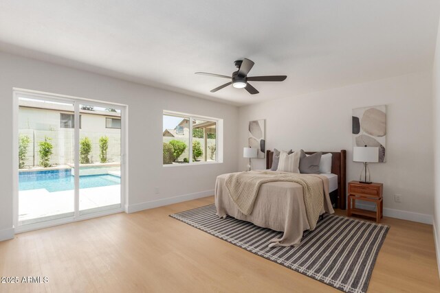4532 E Sandra Ter, Phoenix, AZ 85032 - bedroom with access to outside, light wood-style floors, and a ceiling fan