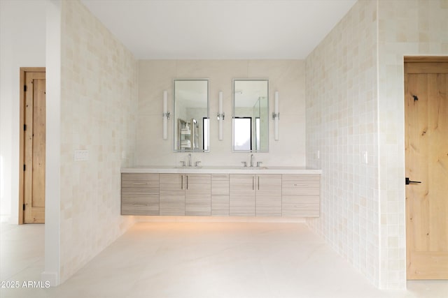 bathroom with tile walls and vanity