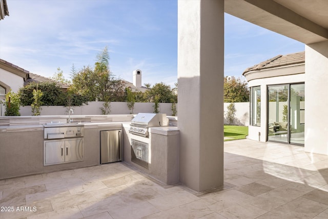 view of patio / terrace with a grill and an outdoor kitchen