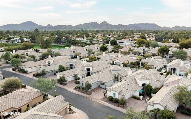 birds eye view of property with a mountain view