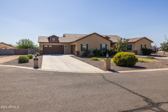 ranch-style home featuring a garage