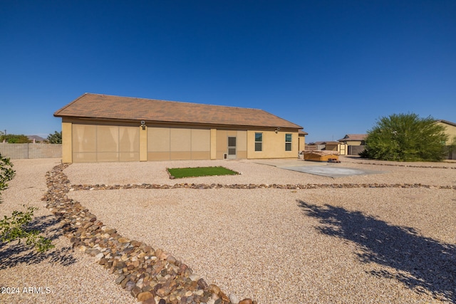 back of property with a patio area