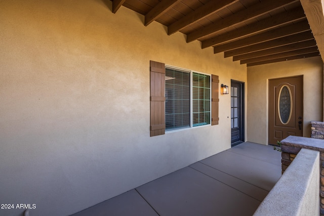 doorway to property featuring a patio area