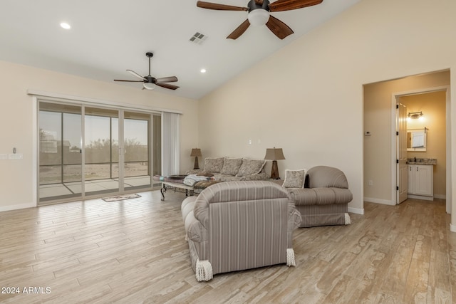 living room with high vaulted ceiling, light wood-type flooring, and ceiling fan