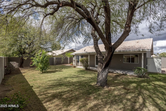 view of yard with a patio and a fenced backyard