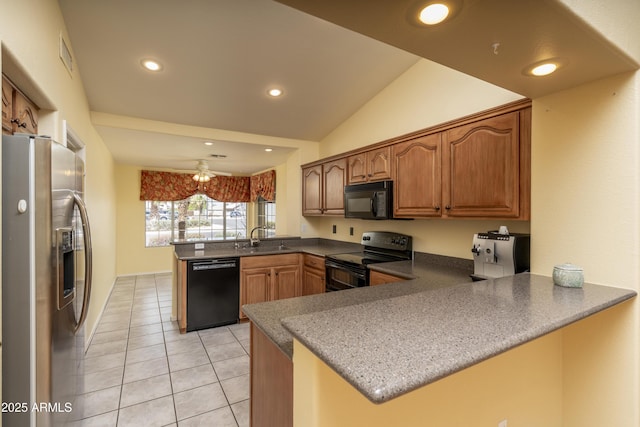 kitchen with light tile patterned floors, a peninsula, recessed lighting, a sink, and black appliances