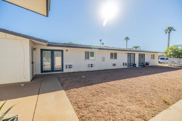 back of property featuring a patio and french doors