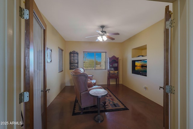 living area with ceiling fan