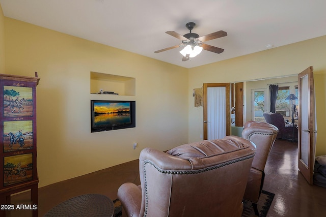 living room featuring ceiling fan and french doors