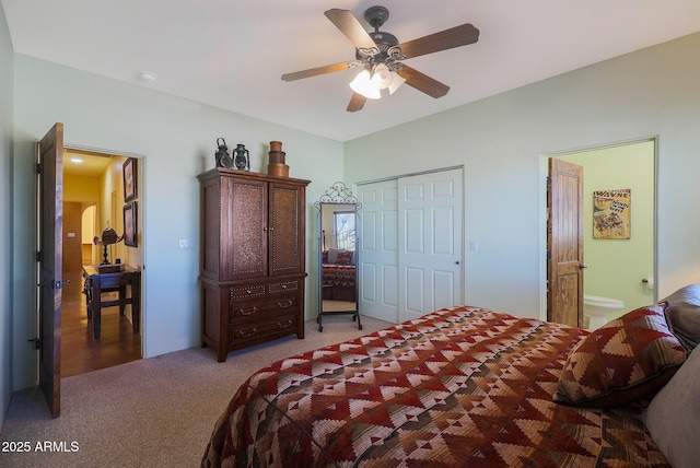 bedroom featuring carpet, ceiling fan, ensuite bathroom, and a closet