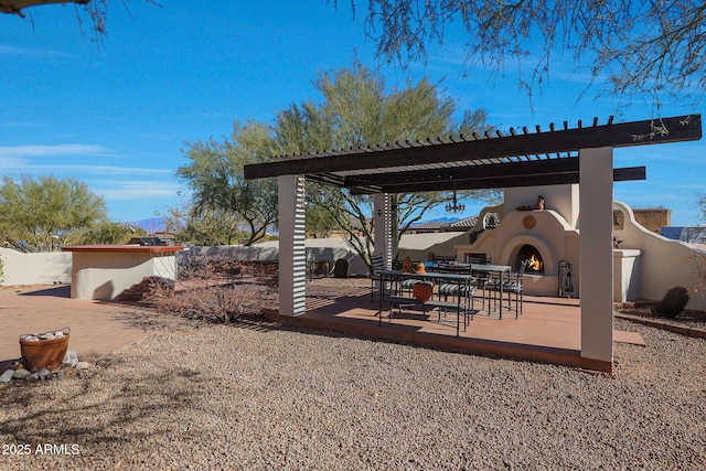 view of patio / terrace featuring an outdoor fireplace