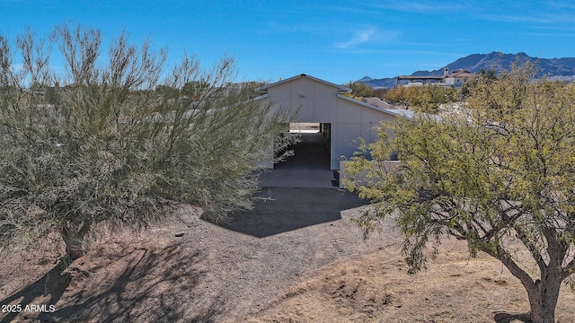 view of side of property with a mountain view