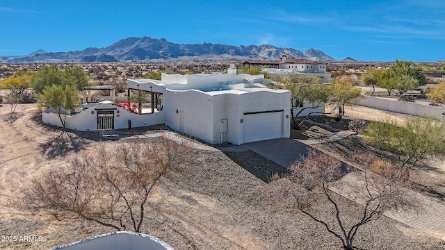 birds eye view of property featuring a mountain view