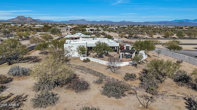 birds eye view of property featuring a mountain view