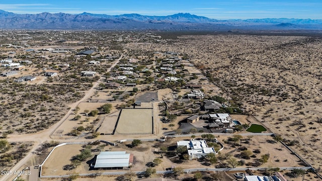 birds eye view of property with a mountain view