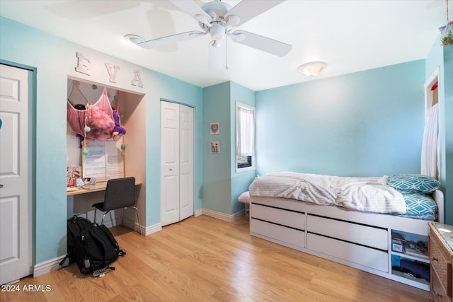 bedroom with ceiling fan and light hardwood / wood-style flooring