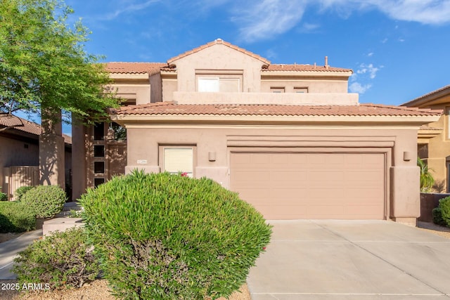 22063 N 77th St, Scottsdale, AZ 85255 - mediterranean / spanish-style house with driveway, stucco siding, an attached garage, and a tile roof
