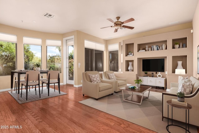 22063 N 77th St, Scottsdale, AZ 85255 - living area with wood finished floors, baseboards, and ceiling fan