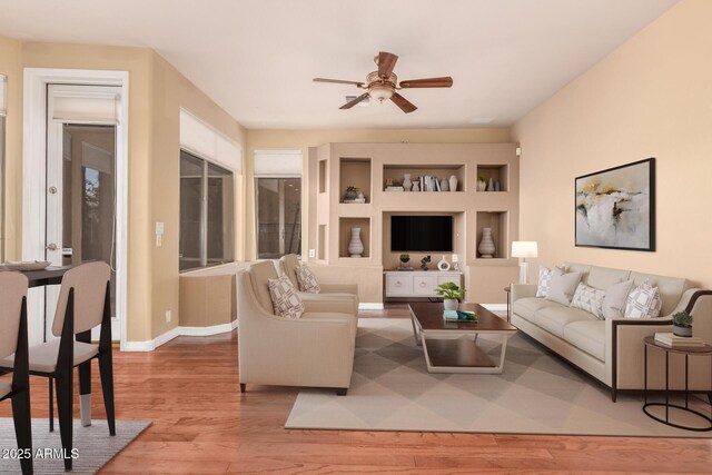 22063 N 77th St, Scottsdale, AZ 85255 - living area with light wood-style flooring, a ceiling fan, and baseboards