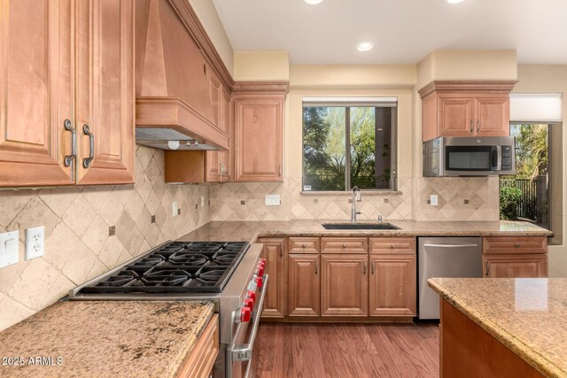 22063 N 77th St, Scottsdale, AZ 85255 - kitchen with appliances with stainless steel finishes, a sink, custom range hood, light stone countertops, and healthy amount of natural light