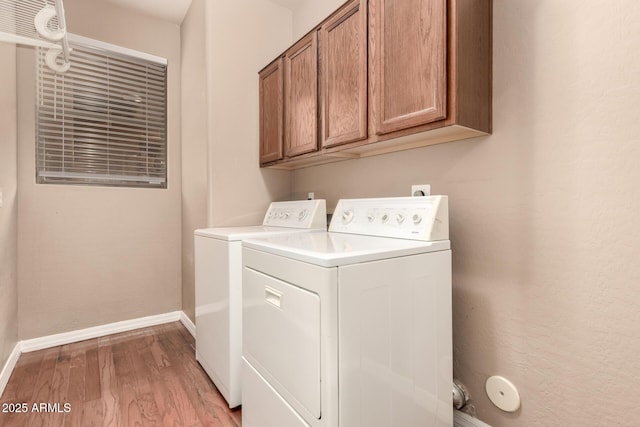 22063 N 77th St, Scottsdale, AZ 85255 - laundry area with separate washer and dryer, cabinet space, light wood-style floors, and baseboards