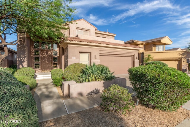 22063 N 77th St, Scottsdale, AZ 85255 - mediterranean / spanish-style house featuring a garage, stucco siding, and a tiled roof