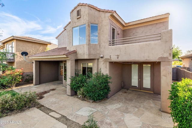22063 N 77th St, Scottsdale, AZ 85255 - view of front of property featuring a balcony, a tiled roof, stucco siding, french doors, and a patio area