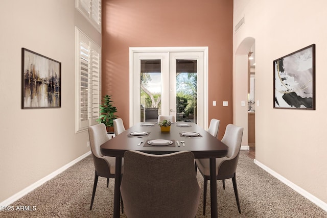 22063 N 77th St, Scottsdale, AZ 85255 - carpeted dining room with arched walkways, baseboards, and french doors