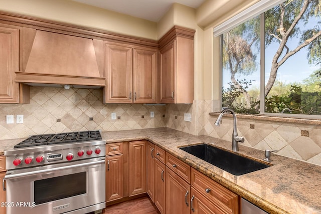 22063 N 77th St, Scottsdale, AZ 85255 - kitchen featuring luxury range, custom exhaust hood, a sink, light stone countertops, and decorative backsplash