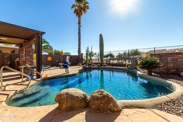 view of swimming pool with a patio