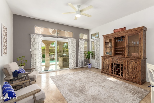 living room with light tile patterned flooring and ceiling fan