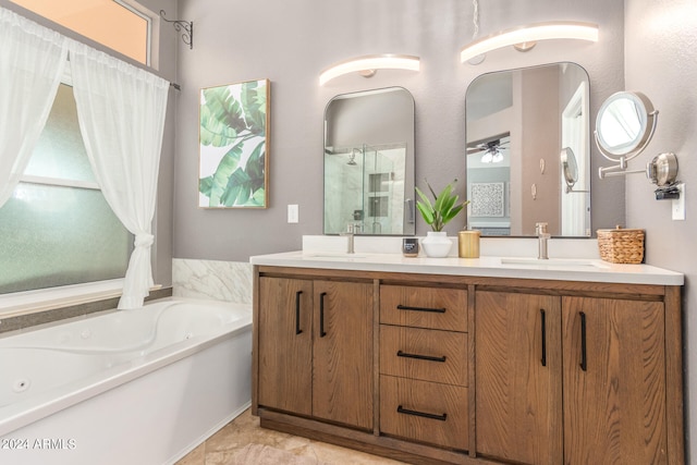 bathroom featuring vanity, independent shower and bath, and ceiling fan