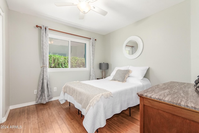 bedroom featuring ceiling fan and wood-type flooring