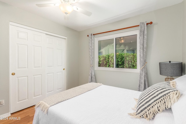 bedroom featuring a closet, ceiling fan, and wood-type flooring