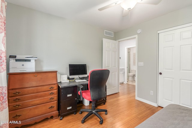 home office featuring ceiling fan and light hardwood / wood-style flooring