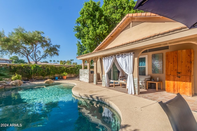 view of swimming pool featuring a patio