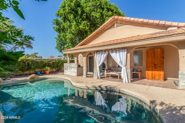 view of pool with a patio