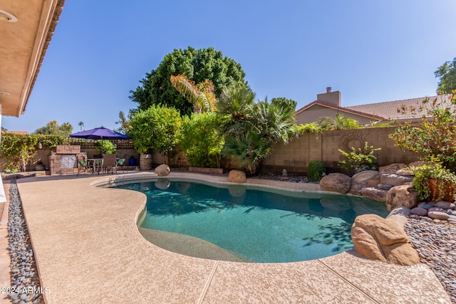 view of swimming pool with a patio area