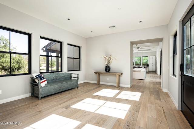 sitting room featuring ceiling fan and light hardwood / wood-style floors