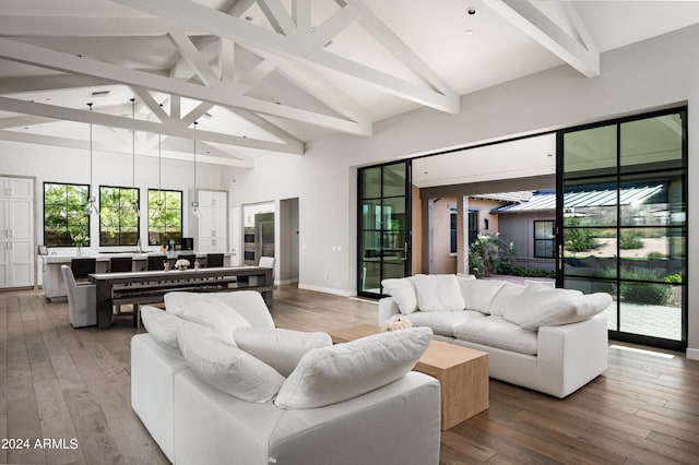 living room with high vaulted ceiling, wood-type flooring, and beam ceiling