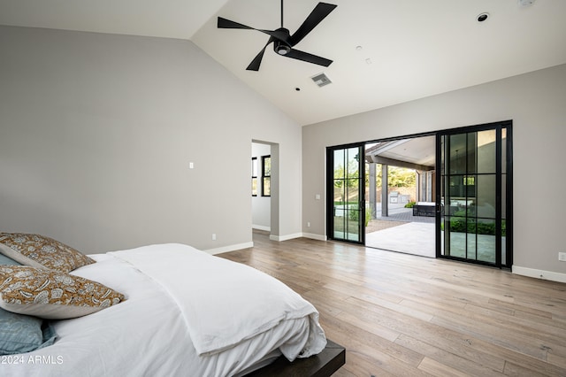 bedroom featuring high vaulted ceiling, light hardwood / wood-style floors, ceiling fan, and access to exterior