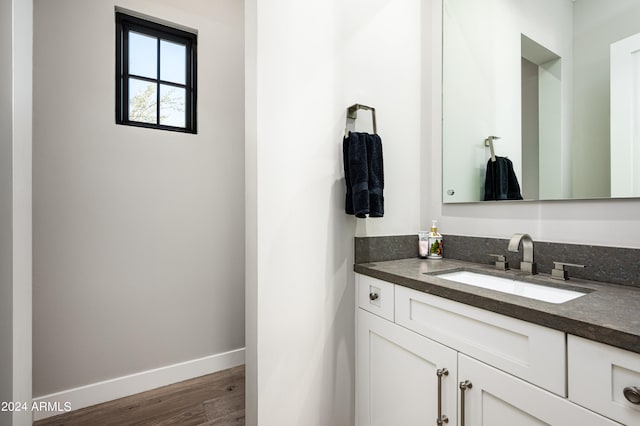 bathroom with vanity and hardwood / wood-style floors