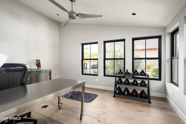 office with light wood-type flooring, ceiling fan, and lofted ceiling