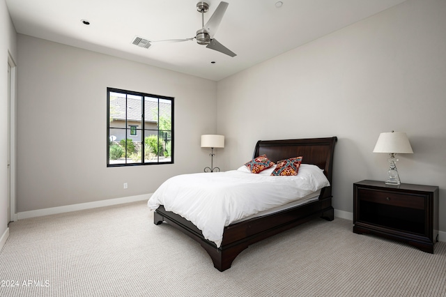 bedroom featuring ceiling fan and light carpet