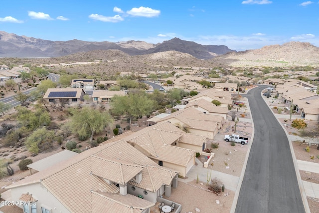 drone / aerial view featuring a residential view and a mountain view