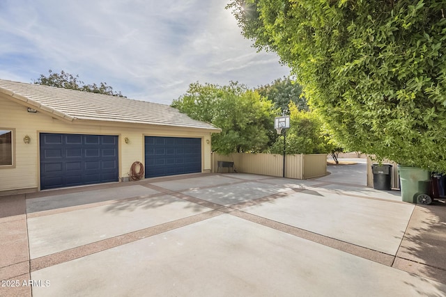 view of side of property featuring an outbuilding and a garage