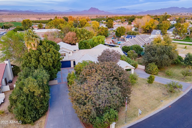 birds eye view of property featuring a mountain view