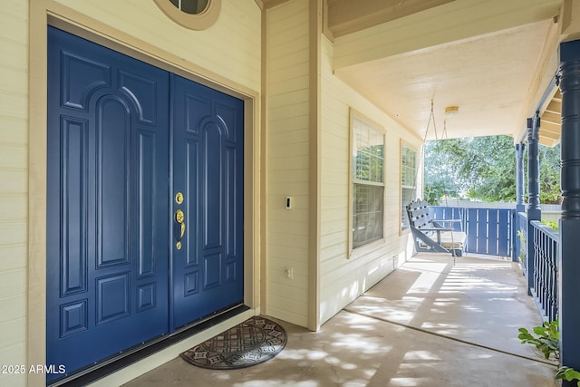 property entrance with covered porch