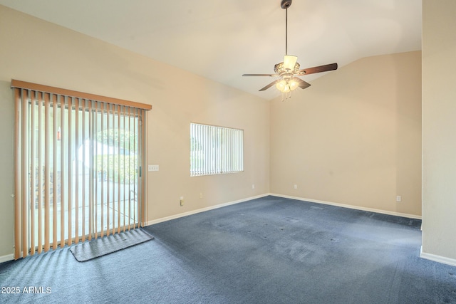 unfurnished room featuring dark carpet, vaulted ceiling, and ceiling fan